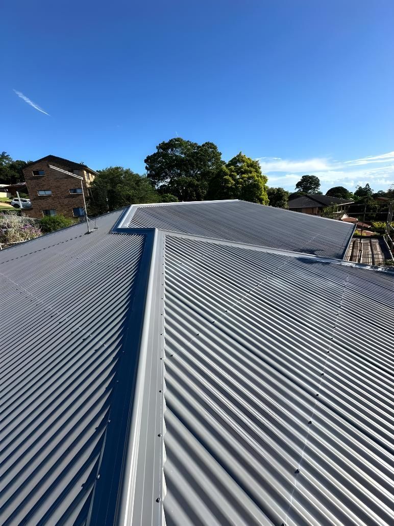 A Close Up Of A Roof With A Blue Sky In The Background — Premier Roofing Solutions In Casino, NSW