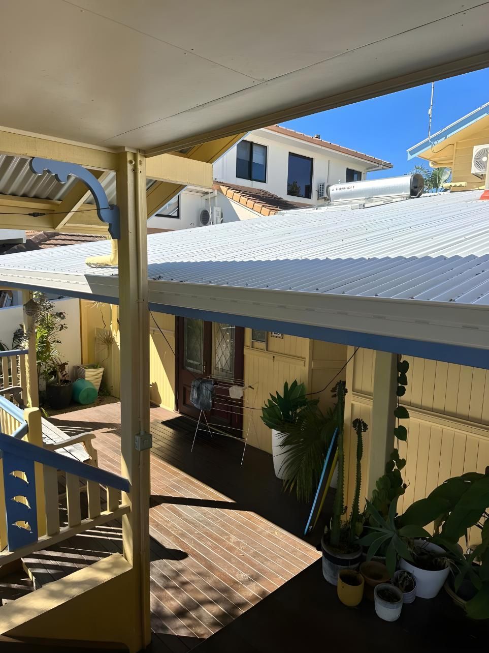 A View Of A House From A Balcony With A White Roof — Premier Roofing Solutions In Lennox Head, NSW