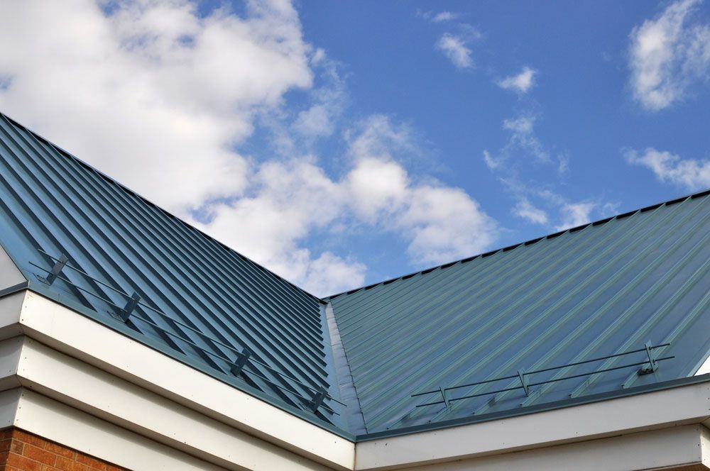 A Blue Roof With A Blue Sky In The Background — Premier Roofing Solutions In Ballina, NSW