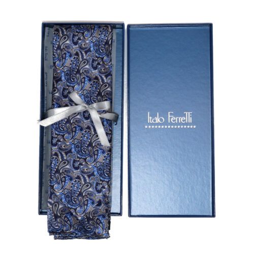 Paisley patterned tie, blue and gray, tied with silver ribbon, in a blue gift box.