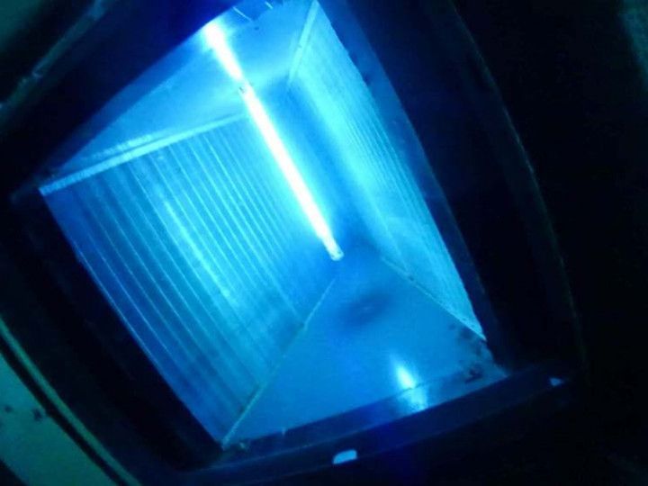 A Blue Light is Shining in a Dark Room