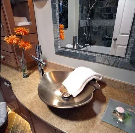 A bathroom sink with a towel on top of it