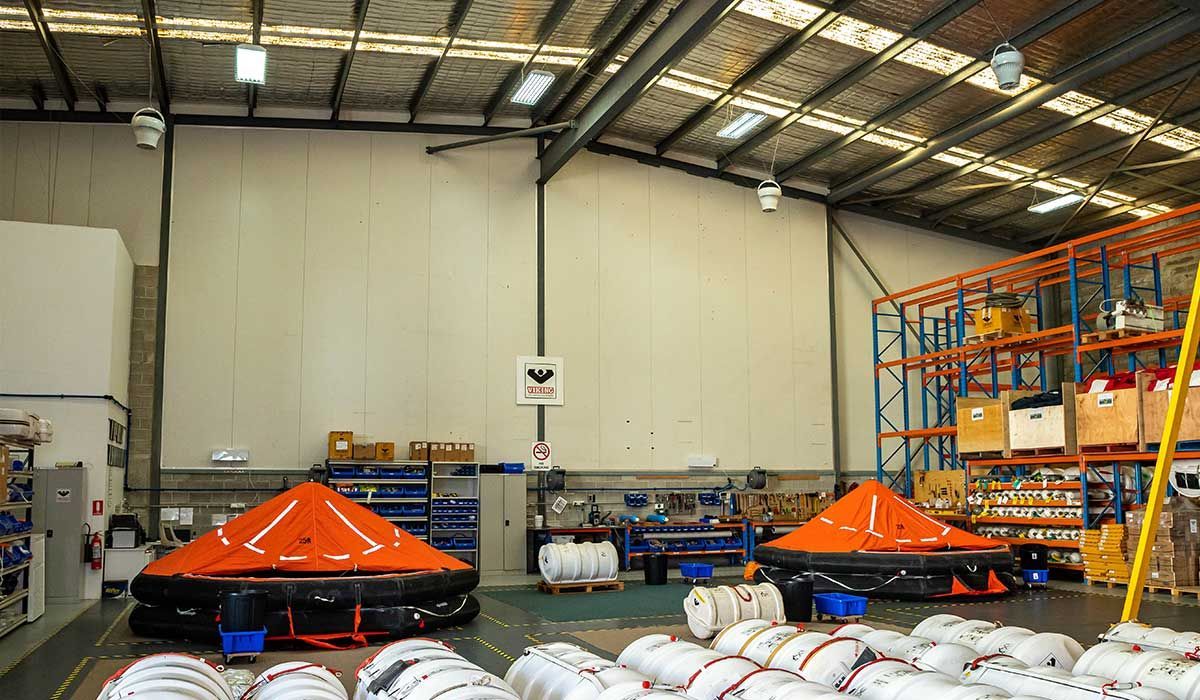 Inside a Factory storage building. Lots of products arrangeed around the floor and shelves