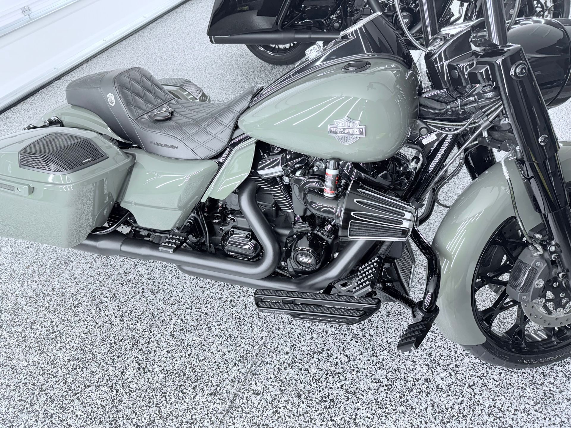 A white ford truck is parked in front of a house.