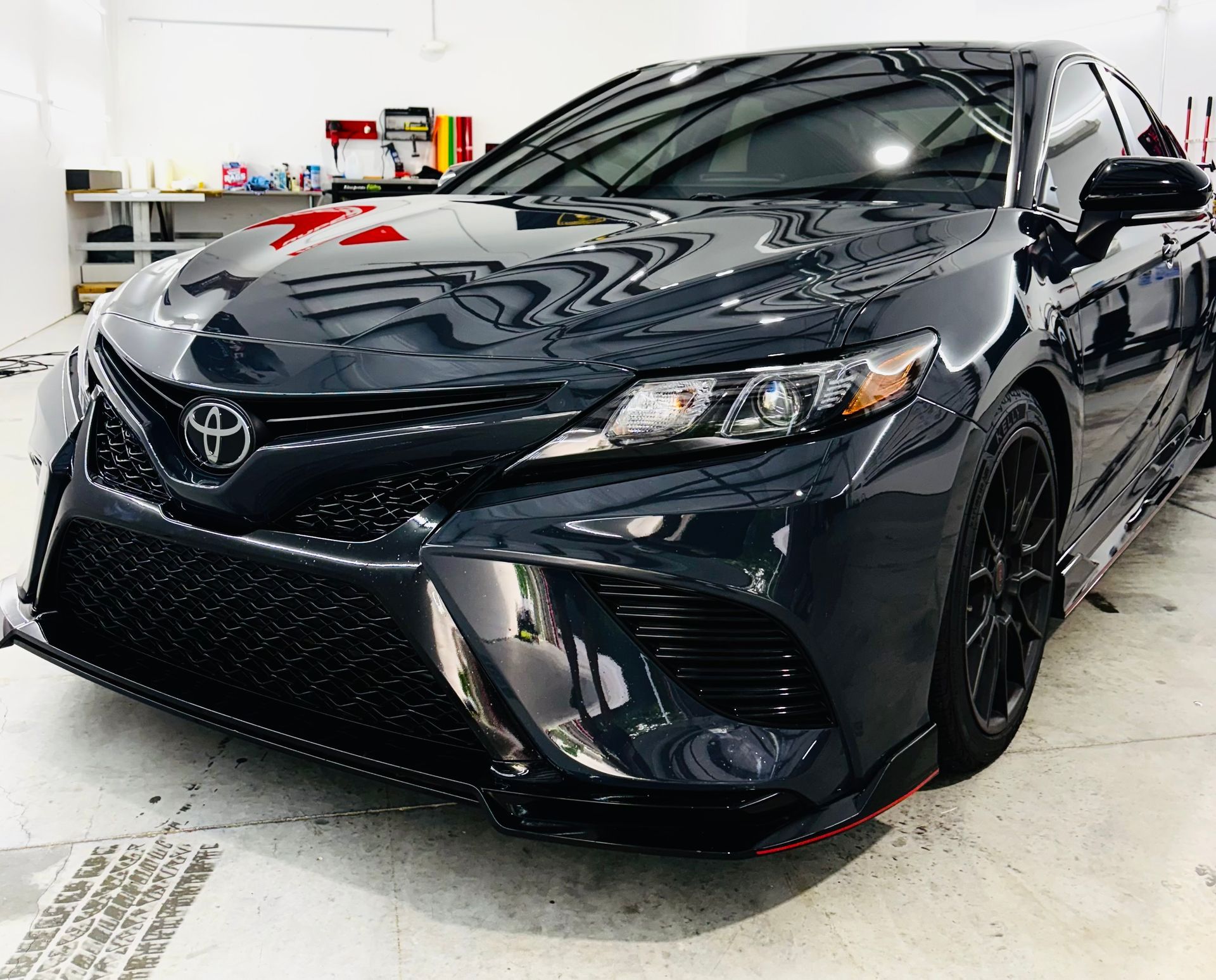 The inside of a blue car with the door open