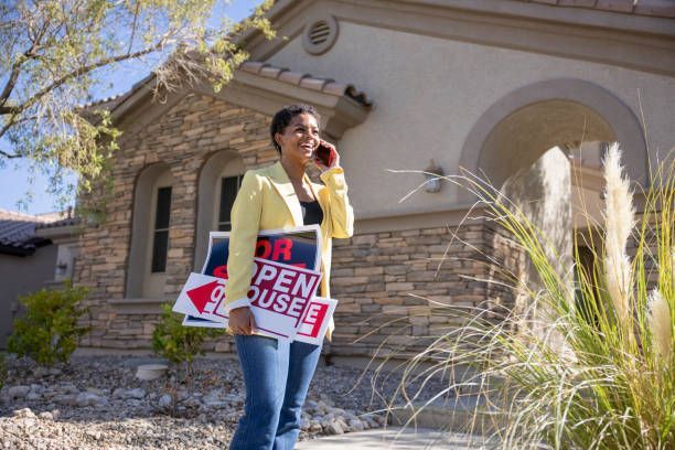 A Woman Is Holding A Sign | El Centro, CA | IV Termite & Pest Control Inc.