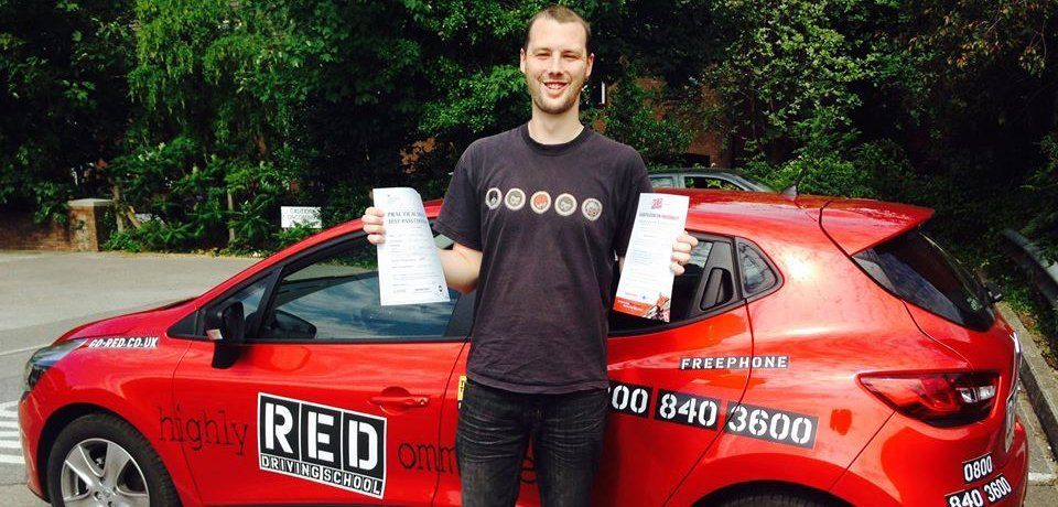 a man showing his driving pass certificate