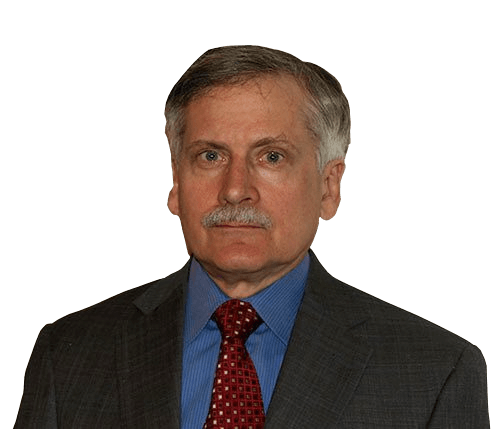 Man in suit, blue shirt, and red tie with mustache, looking forward.
