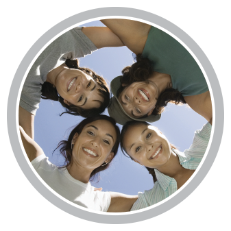 A group of women are standing in a circle and smiling