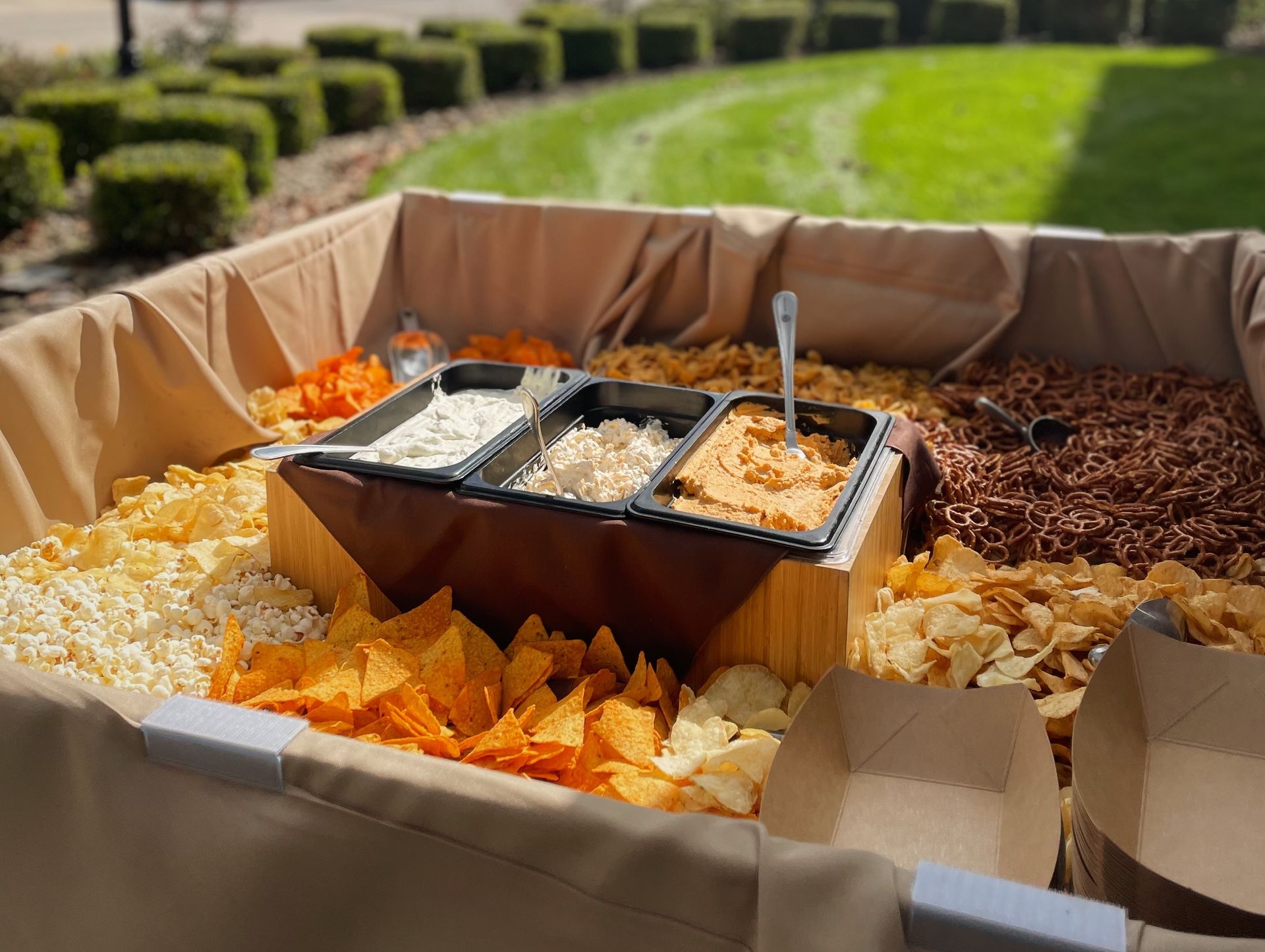 A group of chefs are posing for a picture in a kitchen.