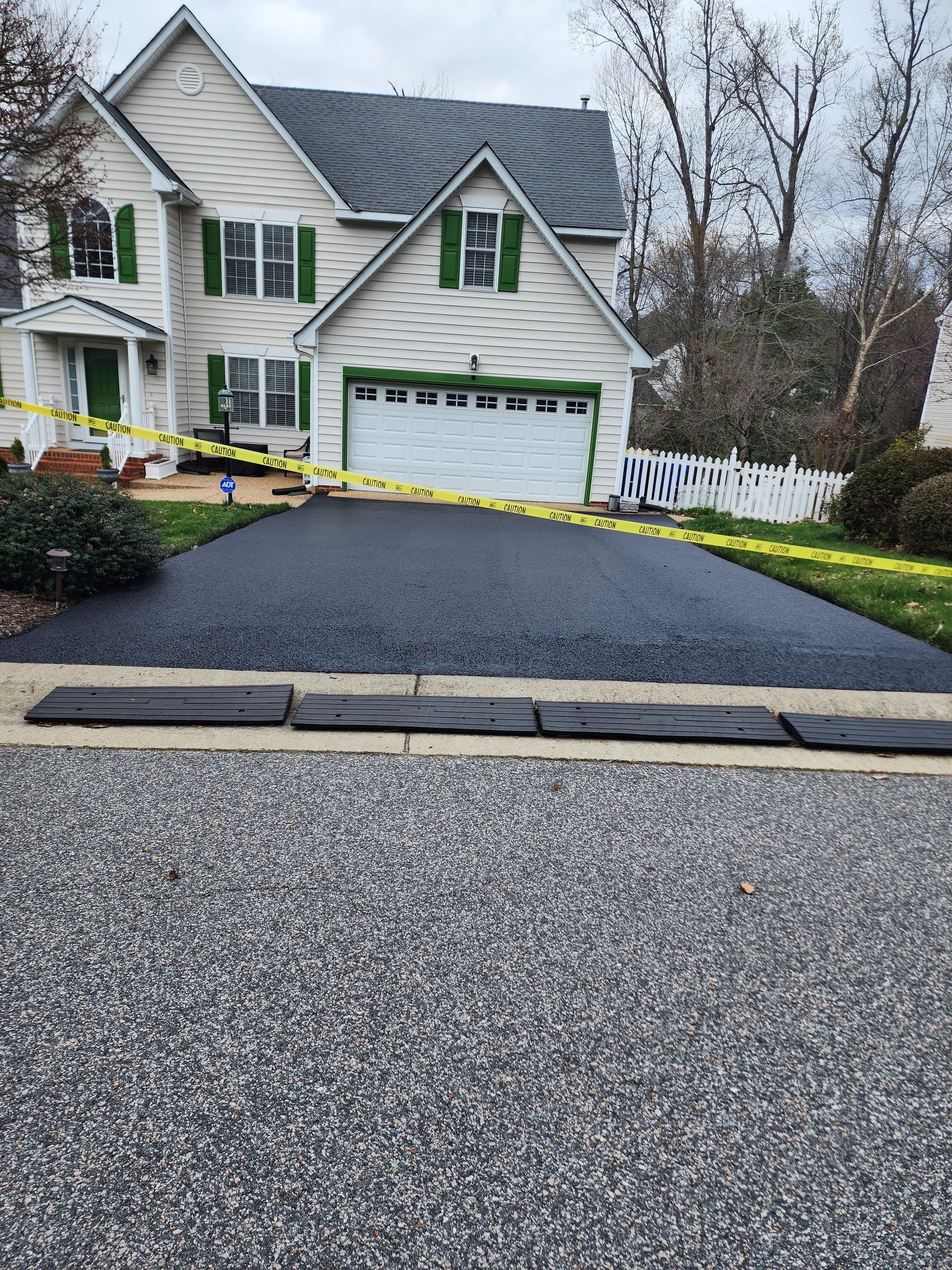 Man Checking the Driveway — Richmond, VA — Rose Paving and Sealing