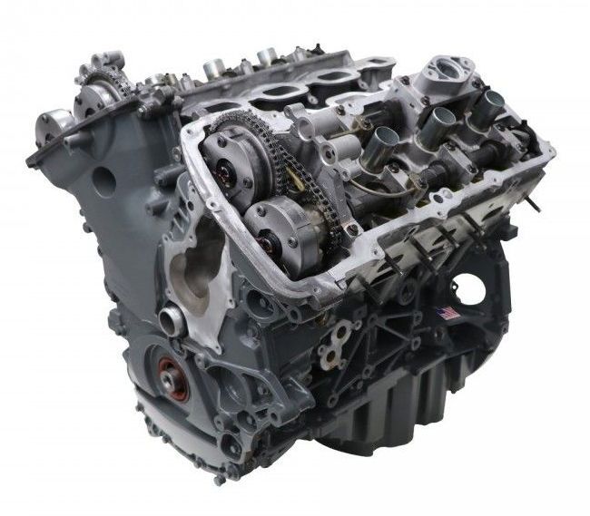 A close up of a motorcycle engine on a white background