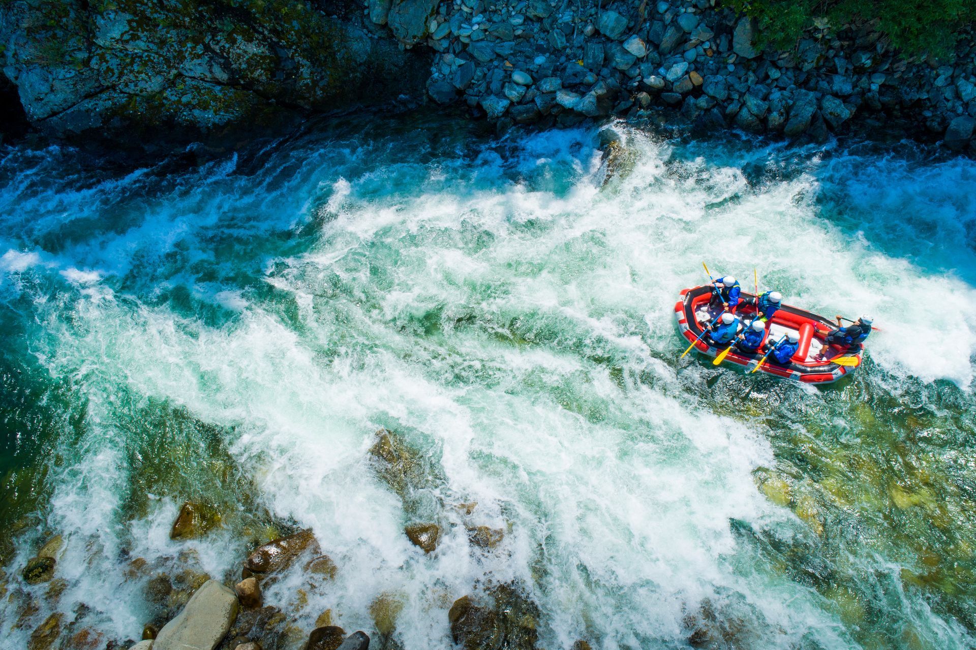 A group of people are rafting down a river.