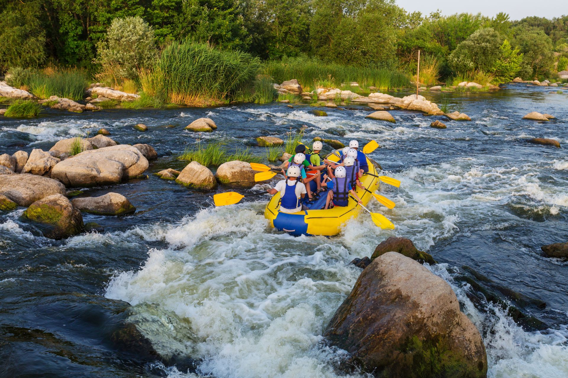 A group of people are rafting down a river.