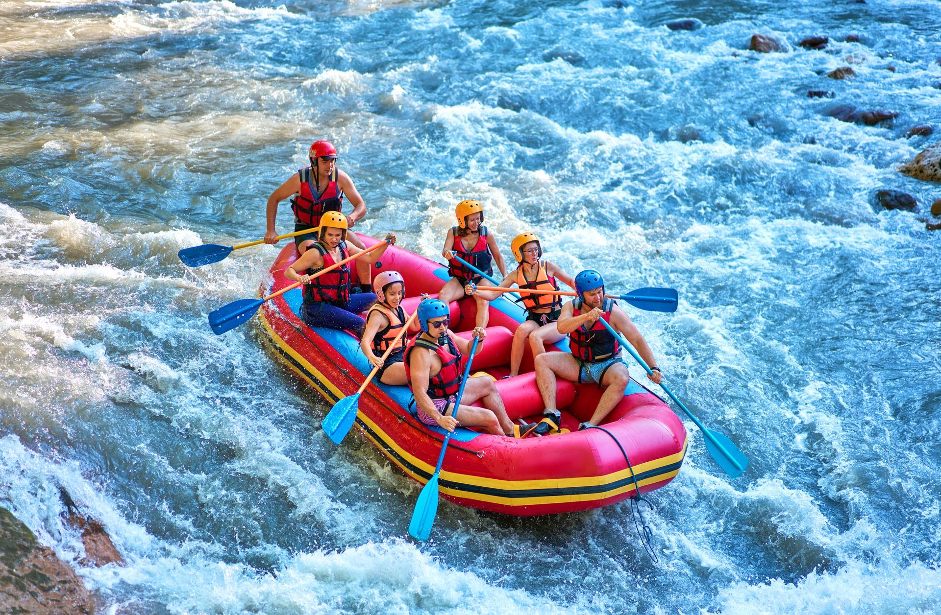 A group of people are rafting down a river.