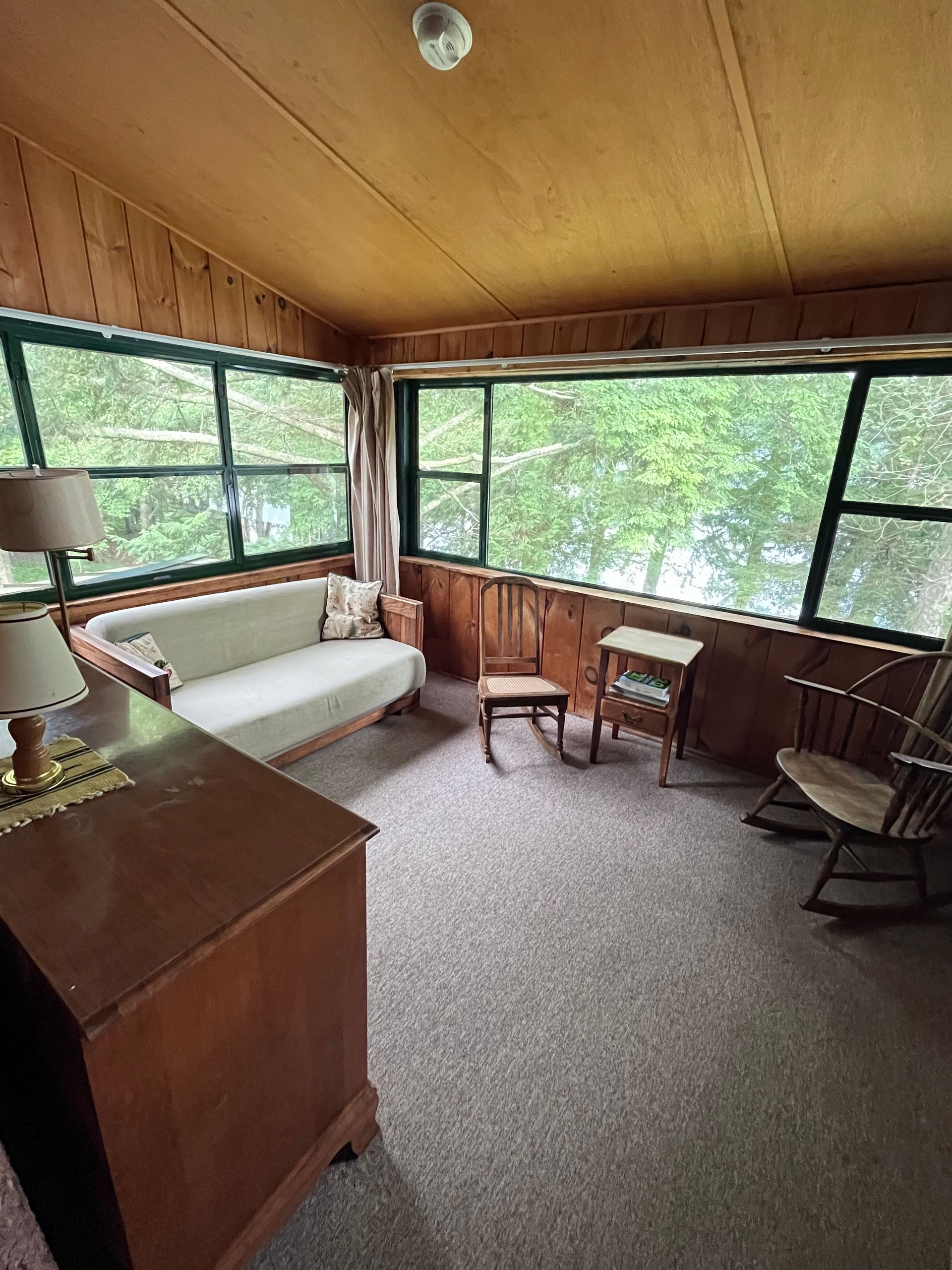 a living area overlooking a lake