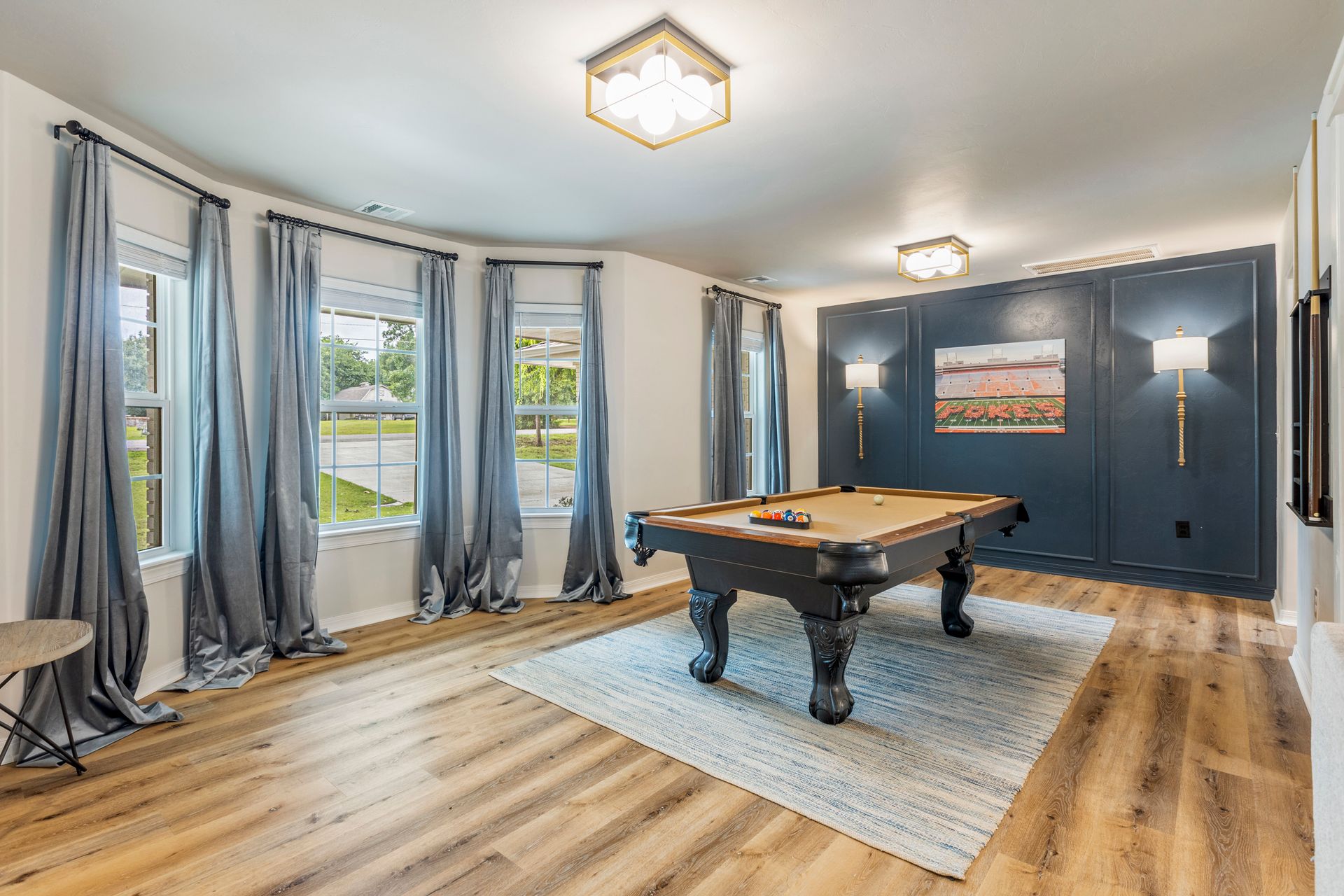 A dining room with open bay windows.