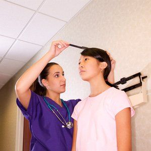Doctor using otoscope for urgent care - Urgent Care in Plant City, FL