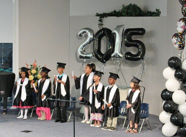 Portrait of children wearing graduation in Chesapeake, VA