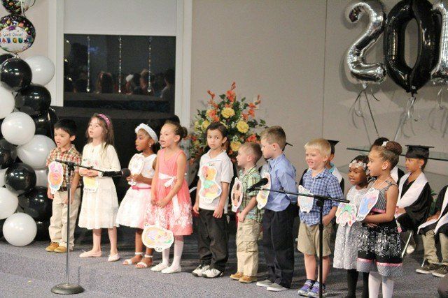 Children singing at a graduation ceremony in Chesapeake, VA