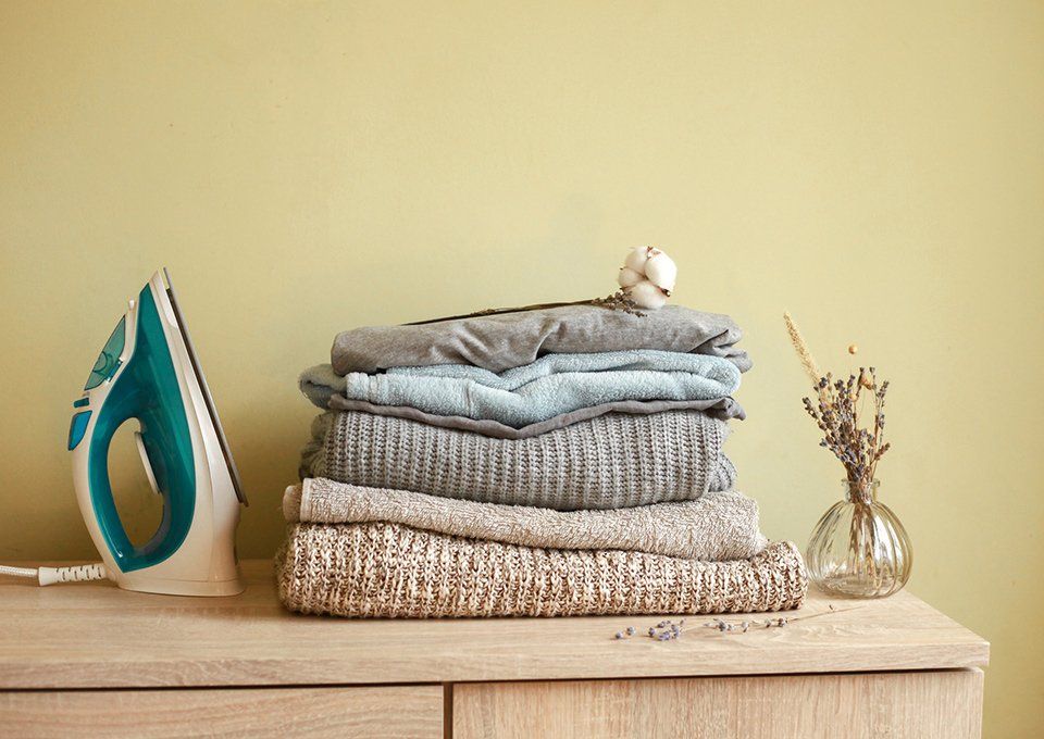Stack Of Clean Clothes At Home — Wichita, KS — Top Priority Concierge