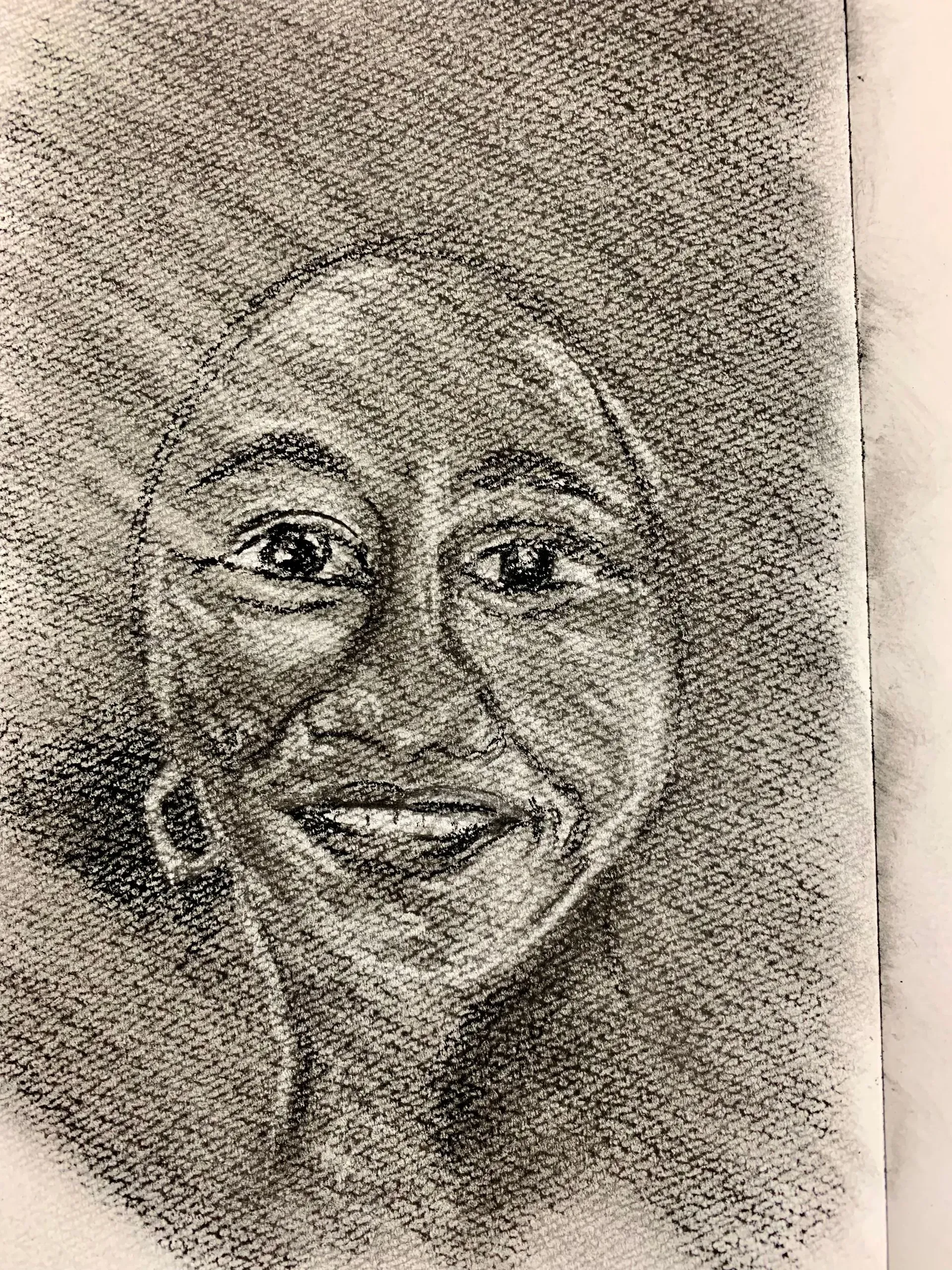 Charcoal portrait of smiling Black woman with large afro and hoop earrings.