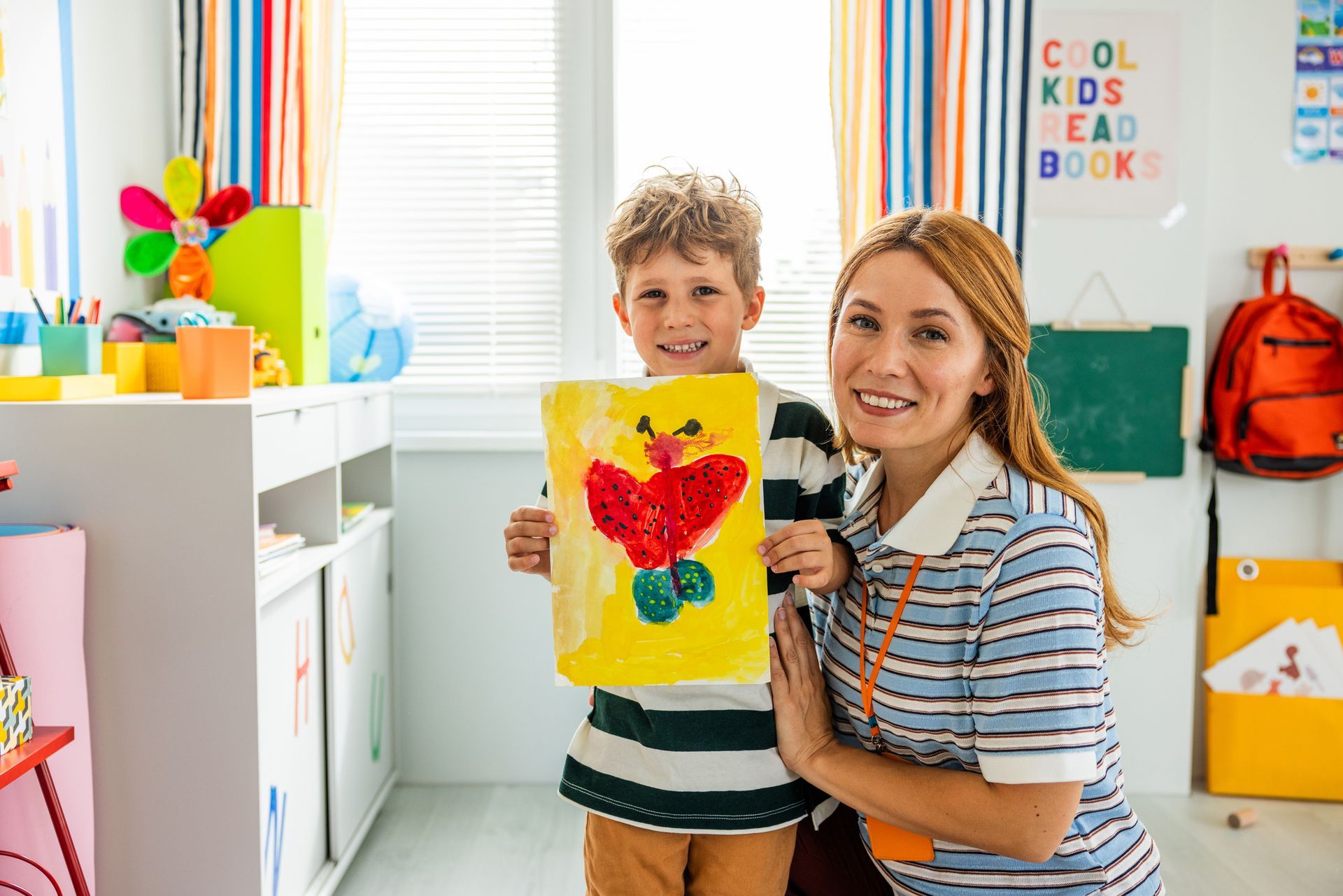 Hands shaping a clay pot on a pottery wheel, focus on the vessel.