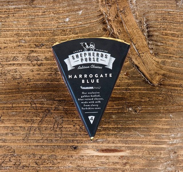 Harrogate Blue is a magnificent addition to any cheese platter, with a rich golden hue and matured for a minimum of 10 weeks to achieve the perfect balance of flavour and creaminess. This cheese has been a success from the start, earning its first accolade just a fortnight after its launch in 2012. It holds a special significance in Shepherds Purse’s history as the inaugural cheese co-created by Katie and Caroline, Judy’s daughters, after taking over the reins of the artisan cheese company. Over the years, Harrogate Blue has garnered numerous prestigious awards on the global cheese scene, including a Super Gold and being ranked as the 11th best cheese in the world at the 2017/18 World Cheese Awards in London. It continued its winning streak with Gold awards in Bergen, Norway in 2018/19, and Bergamo, Italy in 2019/20.