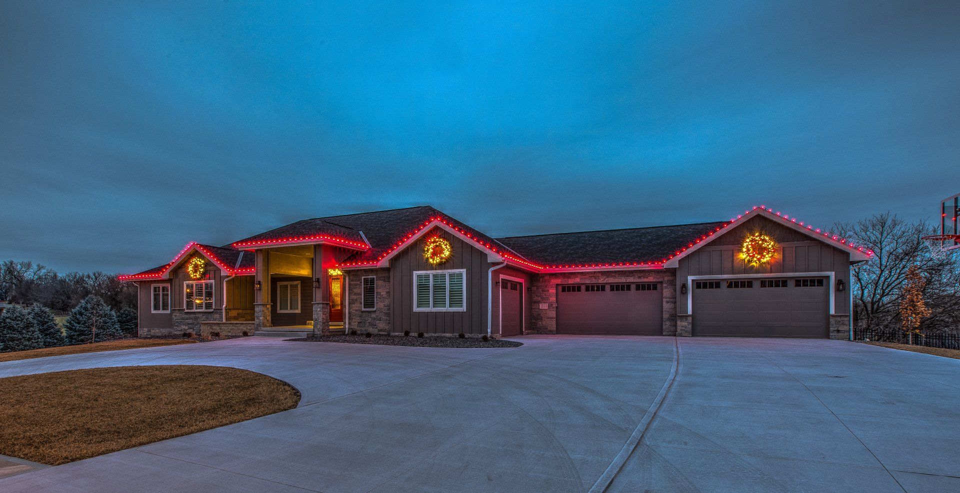 Elegant Christmas lights outlining a Maple Plain, MN rambler home by Jingle Bulbs