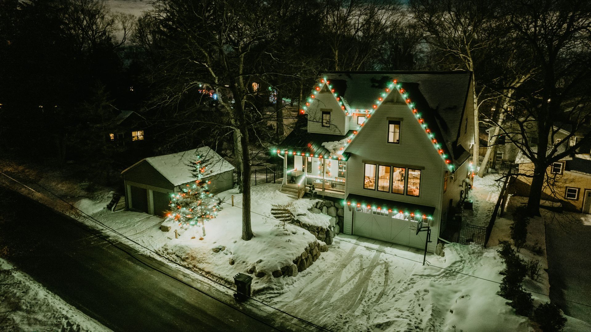 Rustic holiday light display on a country home in Corcoran, MN by Jingle Bulbs Christmas Lighting