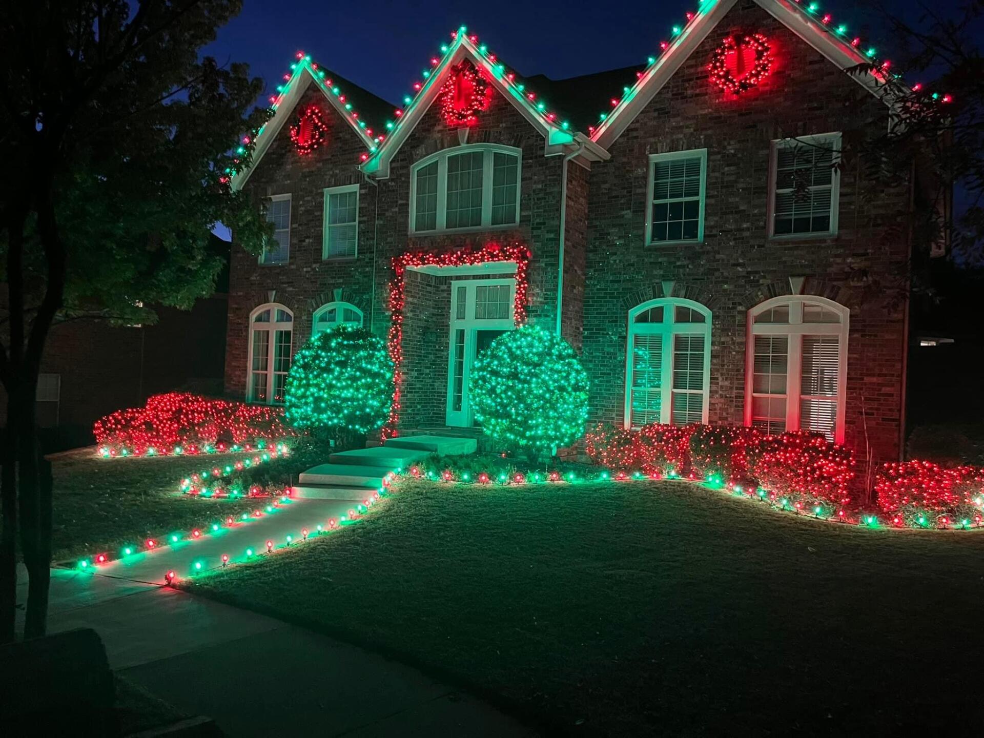 Festive holiday lighting setup on a hillside home in Minnetrista, MN’s Hunters Crest area