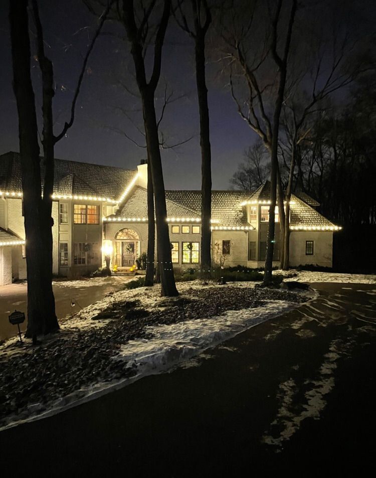Lakeside Christmas lighting wrapped around a Mound, MN home near Three Points