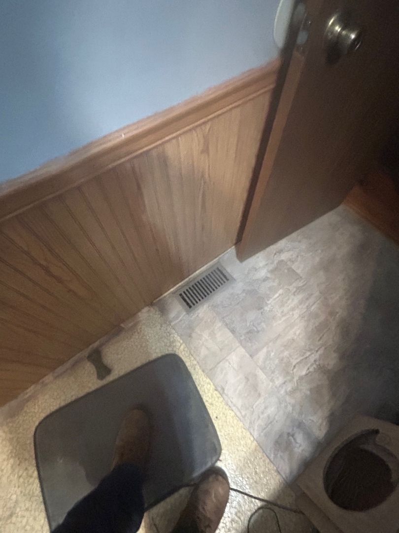 Bathroom entry floor transition area during restoration work