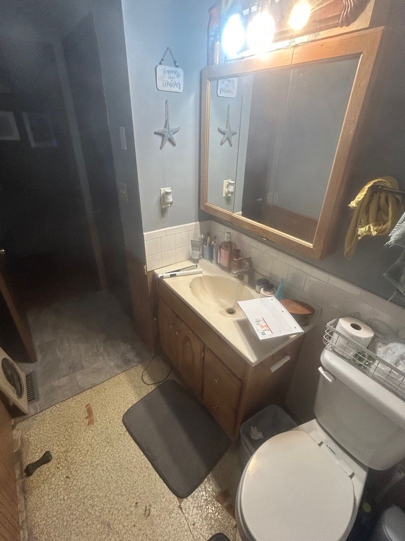 Bathroom vanity area before water damage repairs began