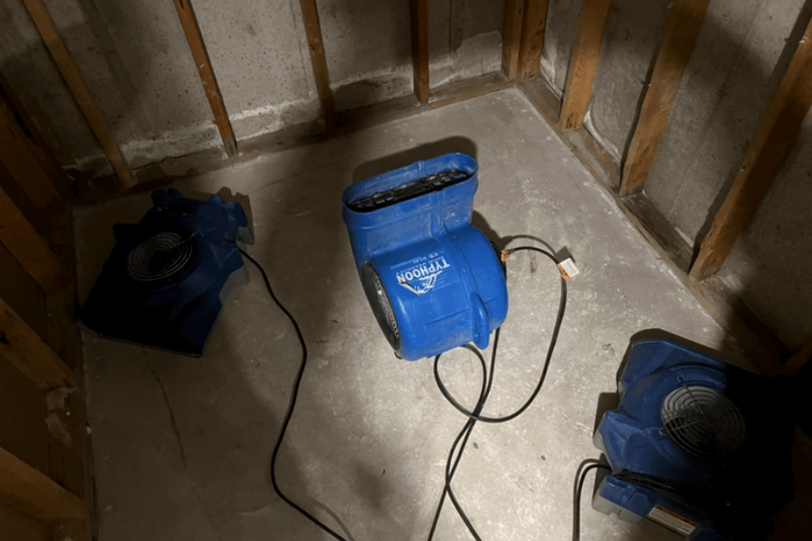 Professional water extraction equipment including air movers and dehumidifiers