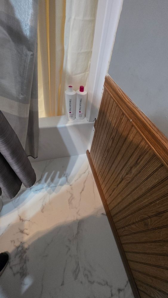 New LVP bathroom flooring installed after water damage restoration