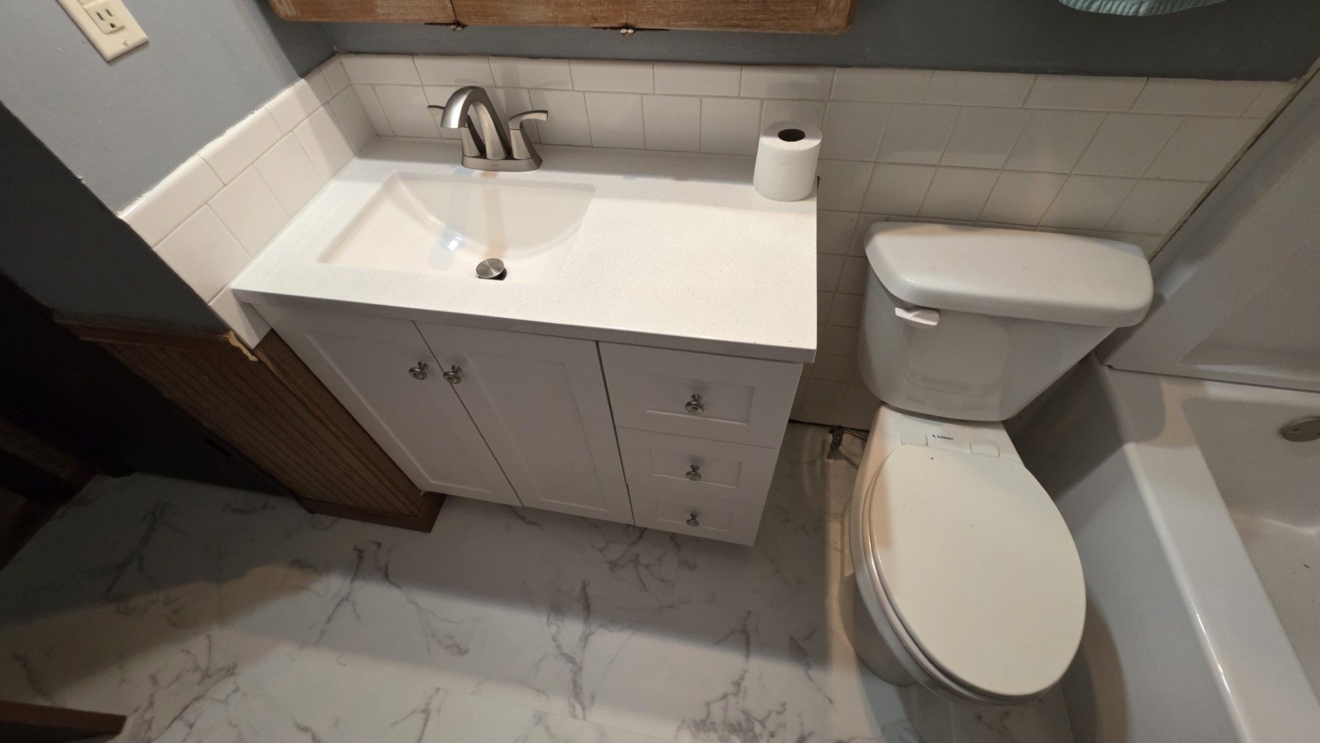 New vanity and toilet installed in restored Springfield bathroom