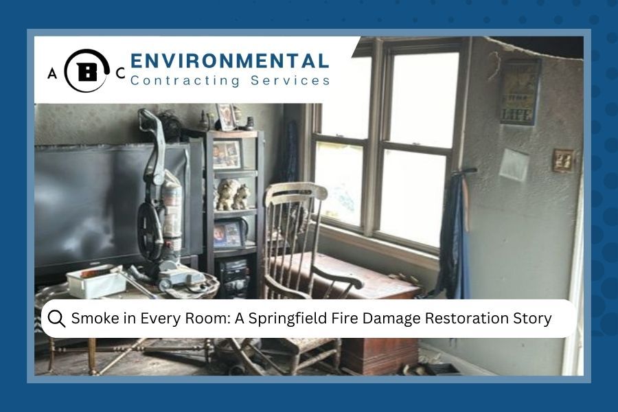 A fire-damaged room with smoke damage. Vacuum cleaner, furniture, and window are visible. ABC Environmental logo present.