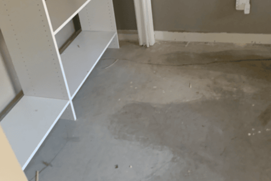 Water damaged subfloor showing visible saturation and damage
