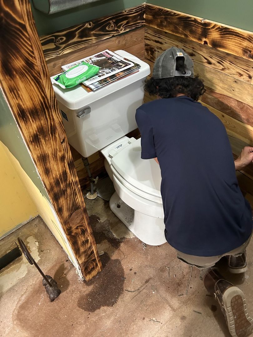 Water damage inspection around toilet area in Hartville bathroom showing moisture intrusion