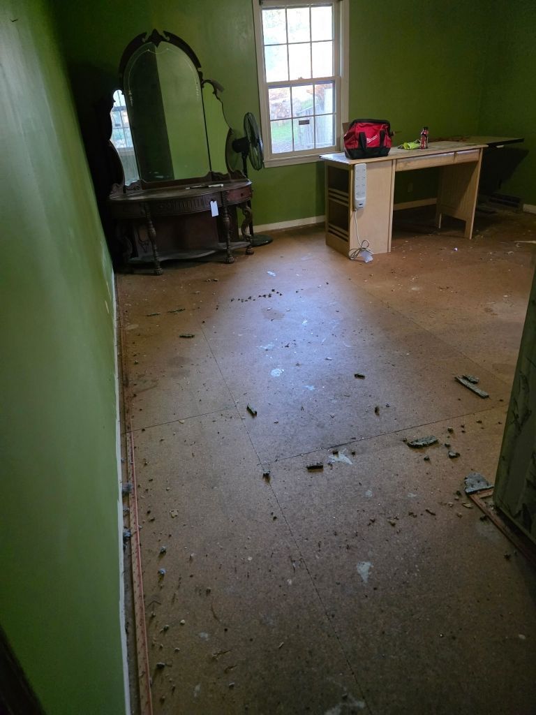 Bedroom with debris and water damage rendering space uninhabitable