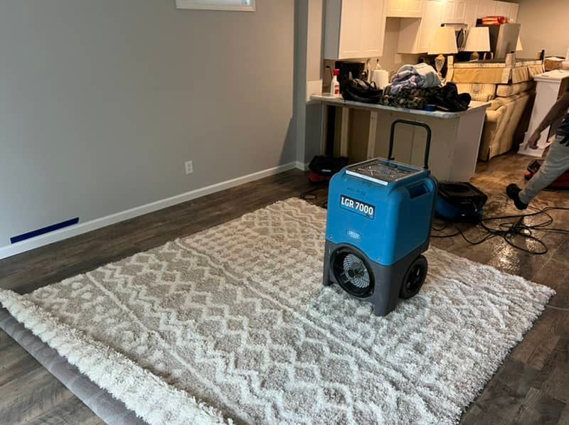 water drying fans placed in living room