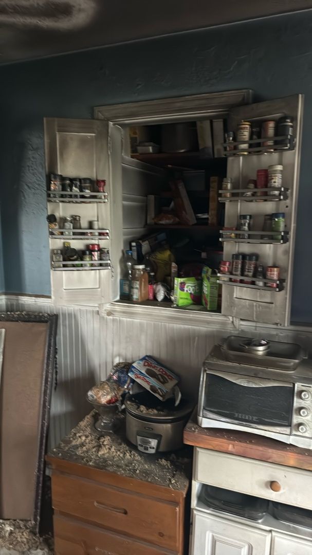 Professional soot removal from kitchen surfaces