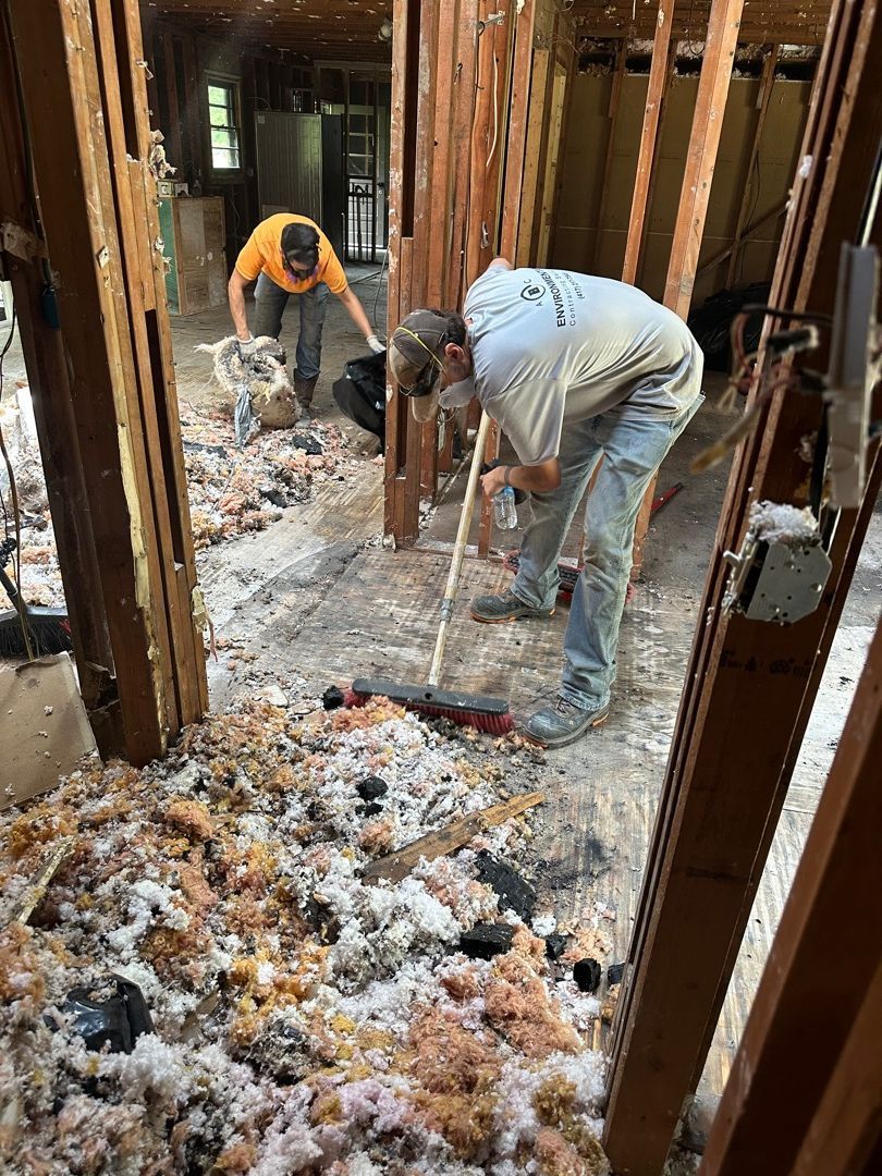 ABC Environmental crew removing burned insulation after fire damage