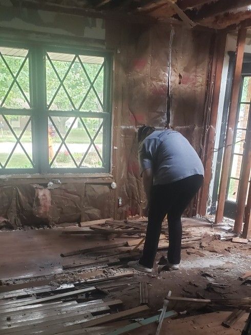 Removing burned hardwood flooring during fire restoration in Springfield