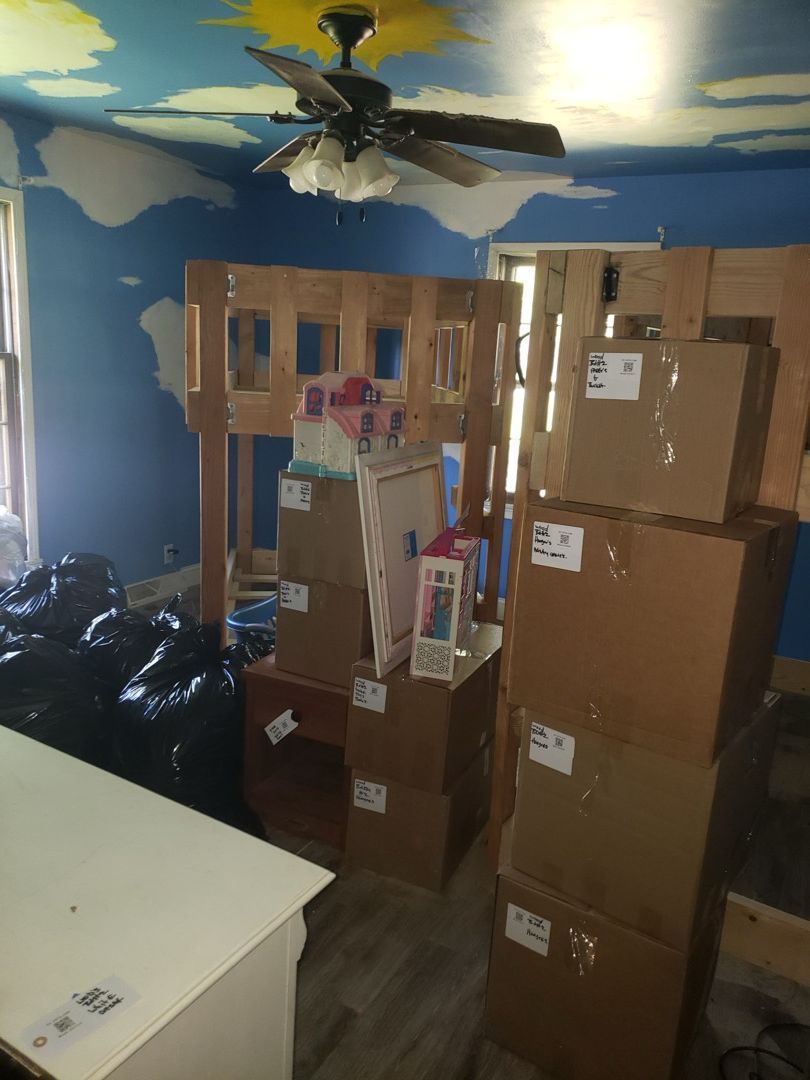 Living room with belongings being prepared for pack-out