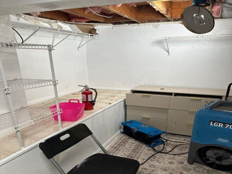 Water mitigation equipment in bedroom