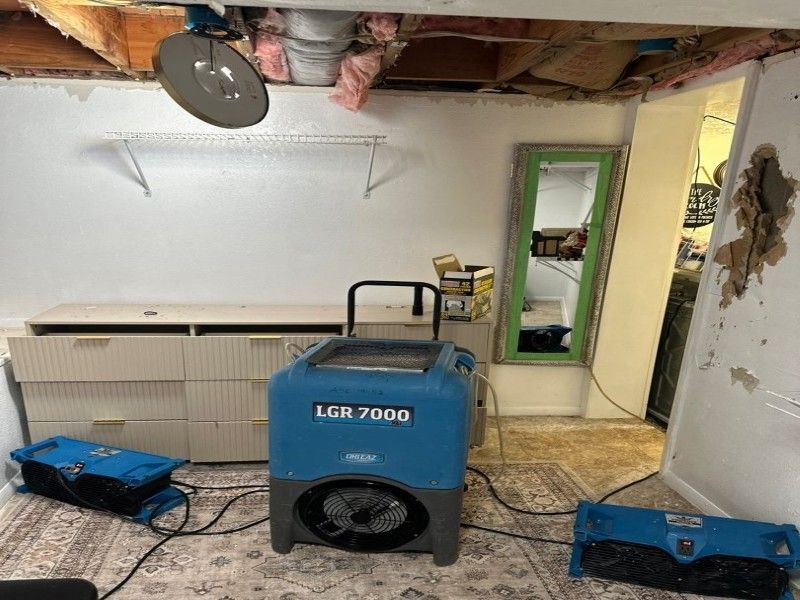 Drying equipment positioned in bedroom