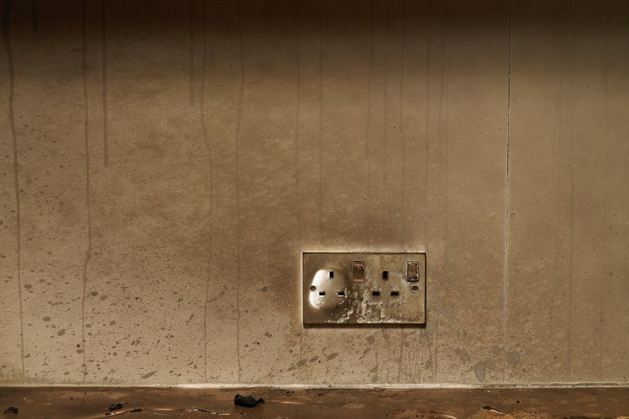 Wall covered with thick soot after a house fire