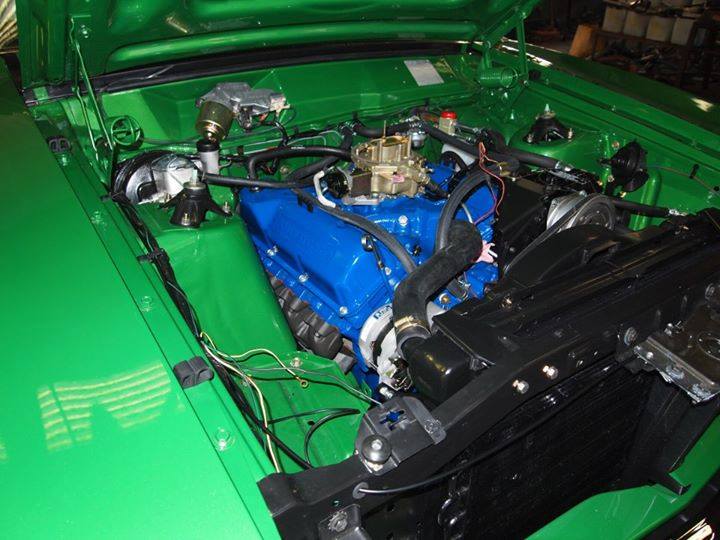 custom engine inside green car